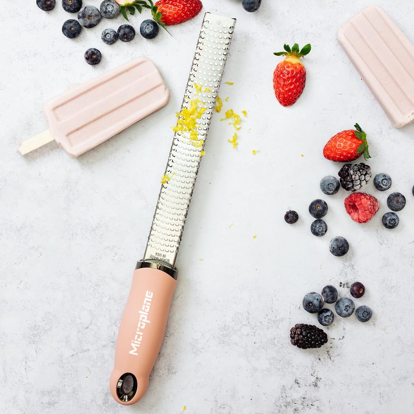 Microplane Zester Grater in Dusty Rose for Citrus Fruits, Hard Cheese, Ginger, Chocolate and Nutmeg with Fine Stainless Steel Blade - Made in USA